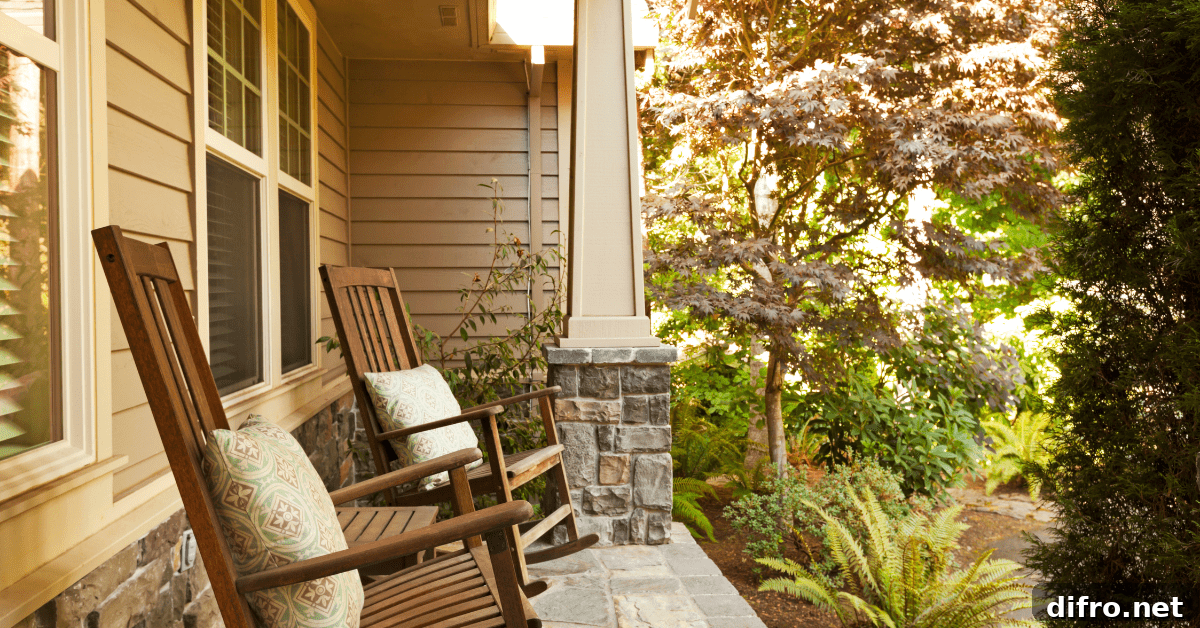 Front porch with furniture and. greenery.