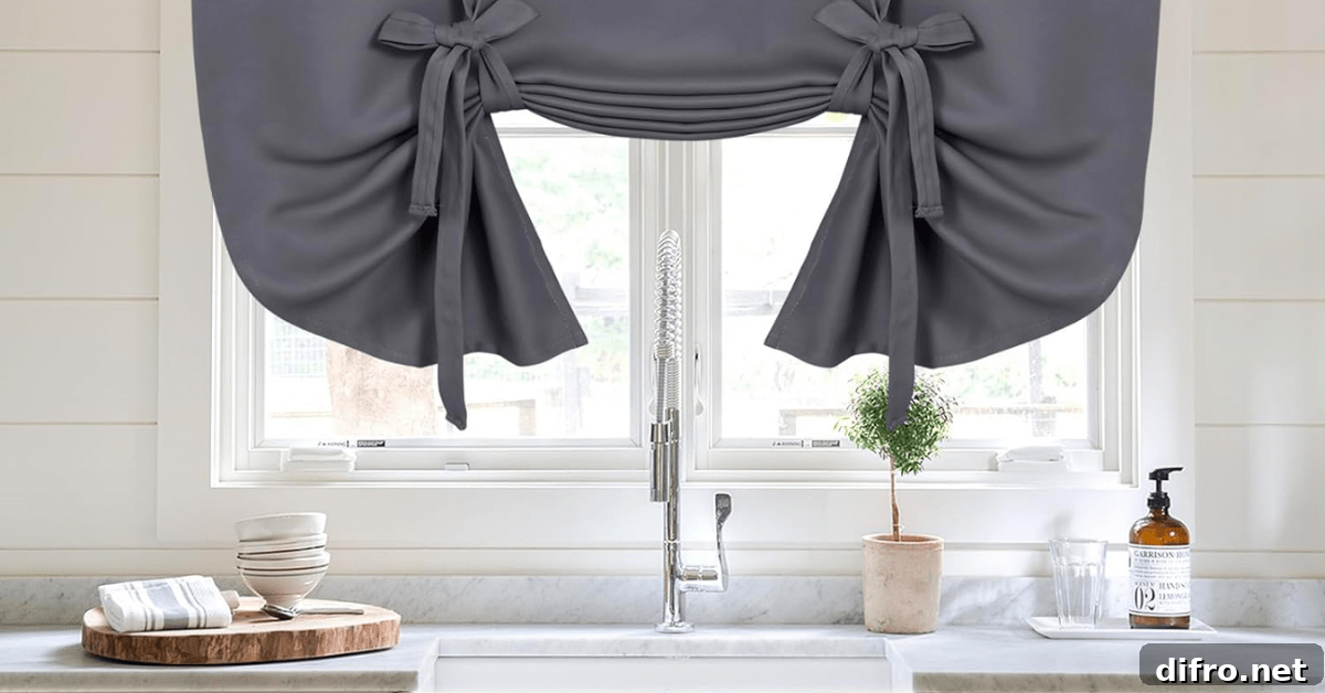 Grey tie-up curtains on kitchen windows.