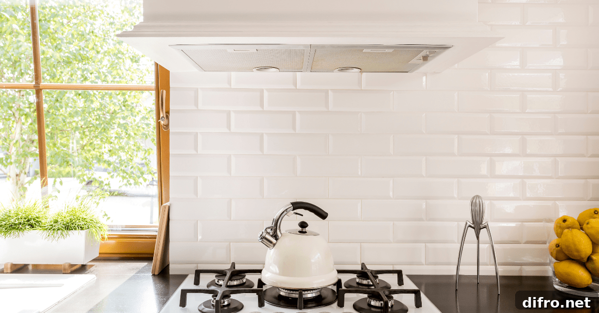 White kitchen with white tile backsplash.