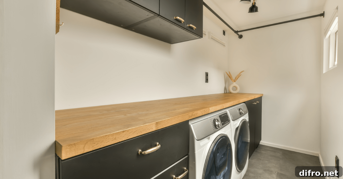 A clutter-free laundry room with black cabinets.