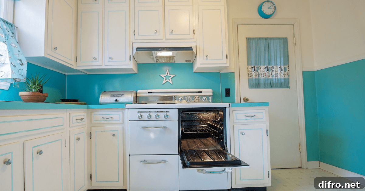 Retro white and blue kitchen with period correct decor.