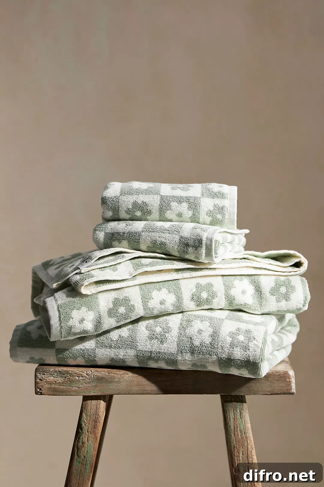 flower power towel folded on wood stool