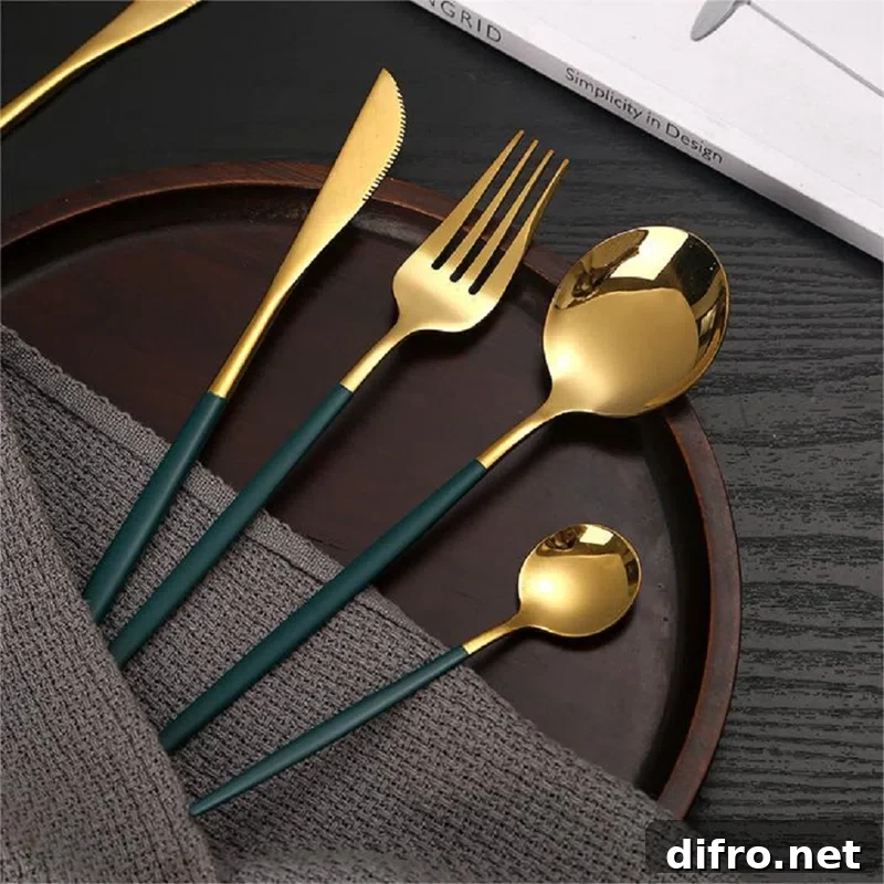 gold and green flatware on a wooden dish