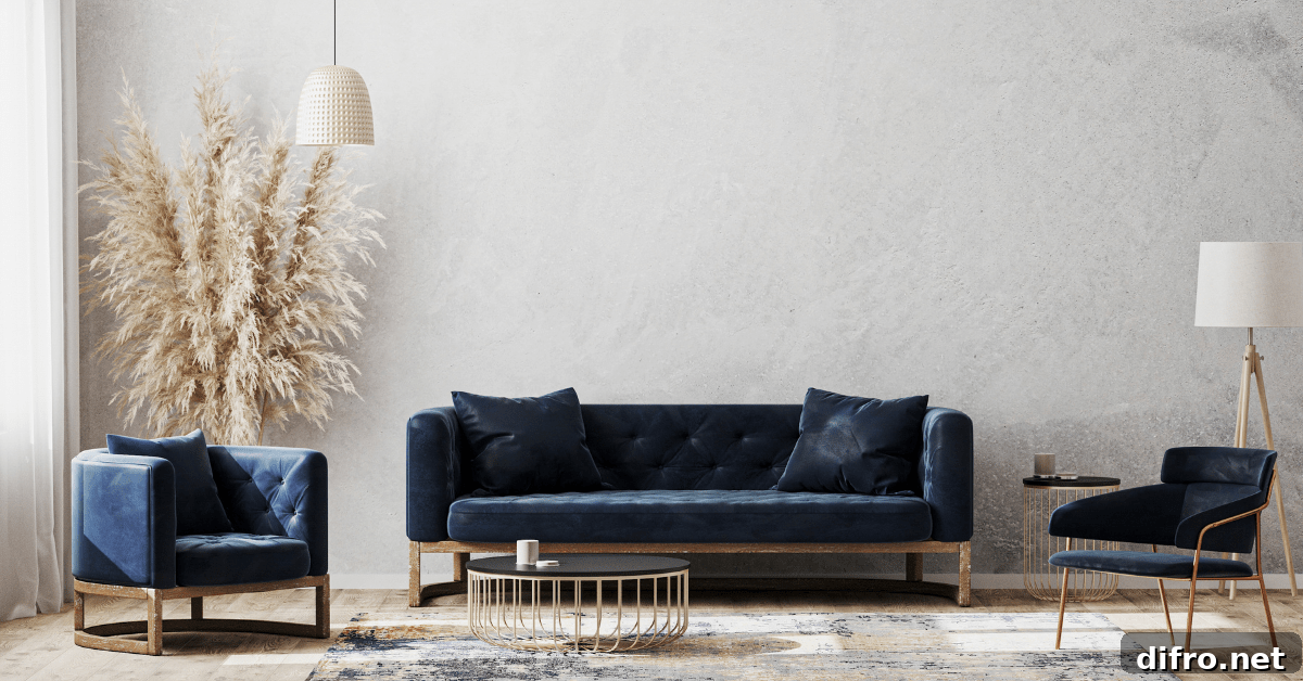 A room with dark blue couches and grey walls.