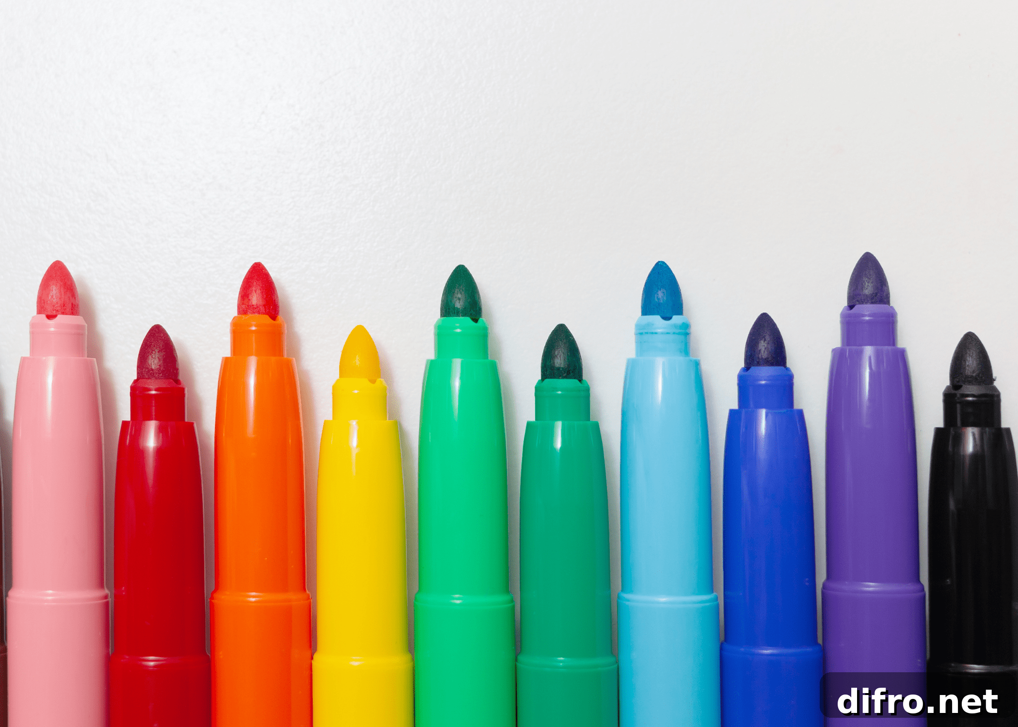 colorful sharpies on white background