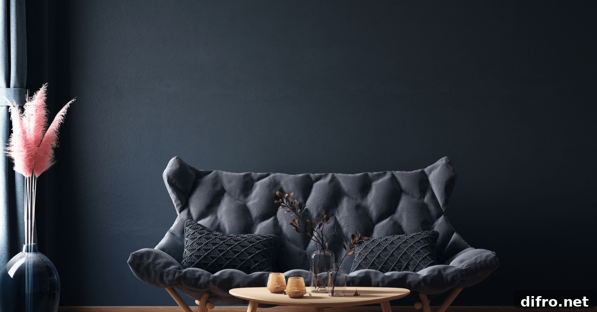 Black painted wall with a dark black couch.