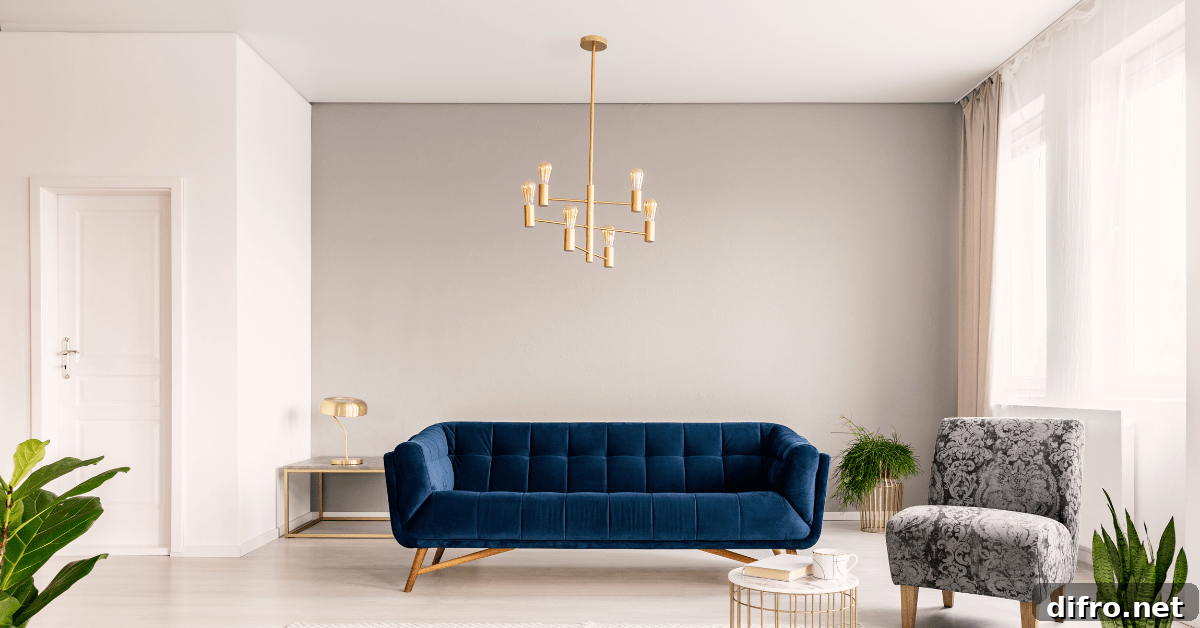 A blue couch with white painted ceiling.