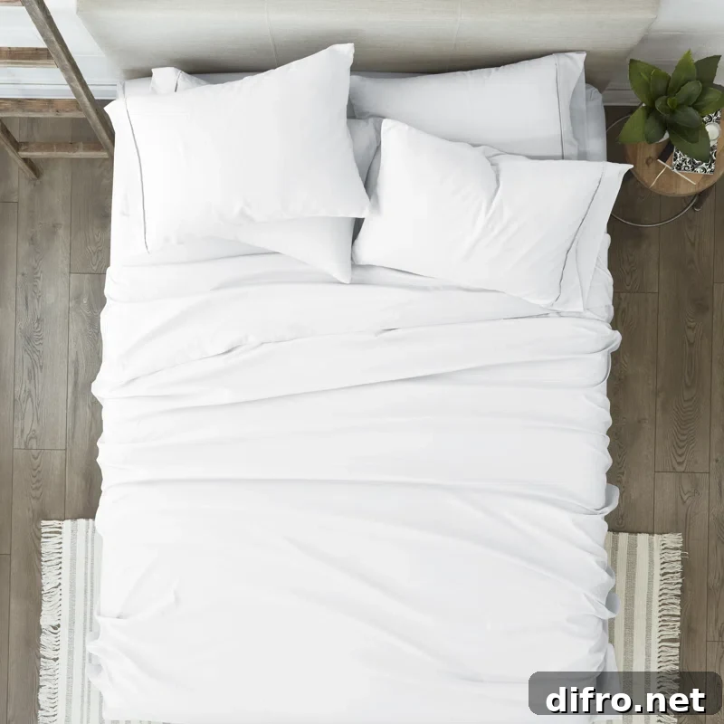 white microfiber bedsheets on bed top view photo