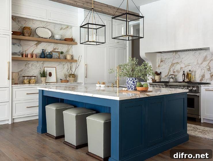 Three gray storage ottomans double as counter stools tucked under a bold blue wooden kitchen island illuminated by square black lanterns.