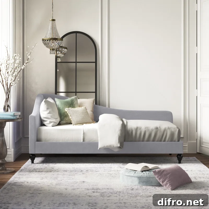 blue lounge style daybed with arch mirror behind