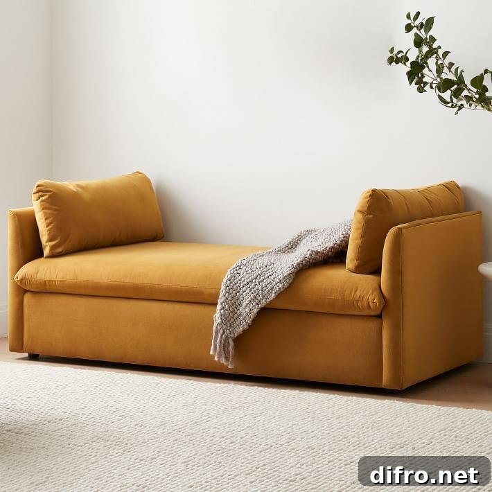 mustard yellow day bed with no back in white living room
