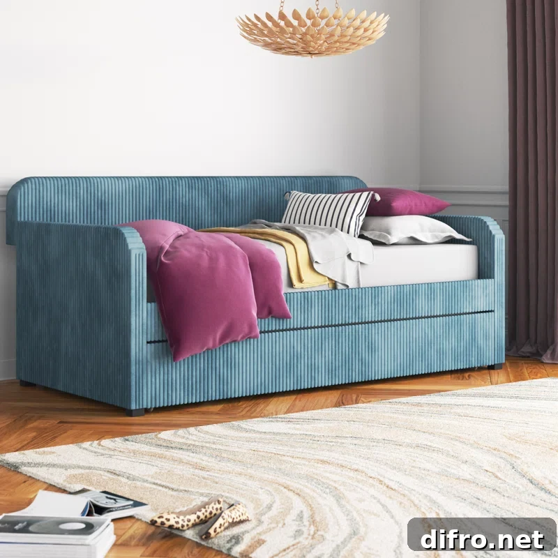 upholstered day bed with trundle magenta pillows in living room