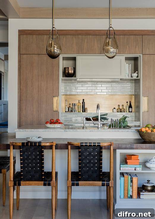 Modern kitchen with mixed wood island and seating that highlight varied wood finishes.