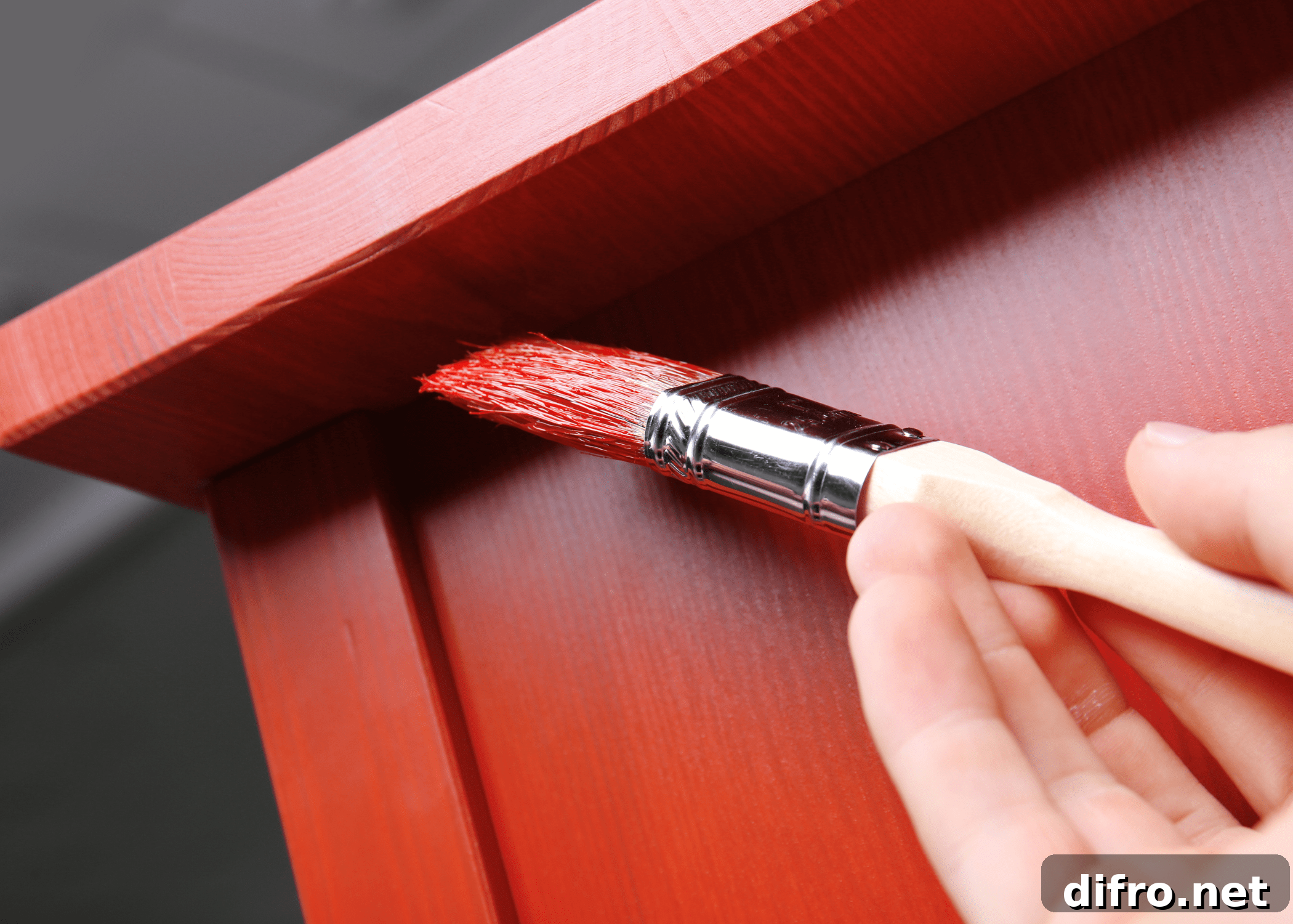 painting underneath a piece of IKEA furniture red close up
