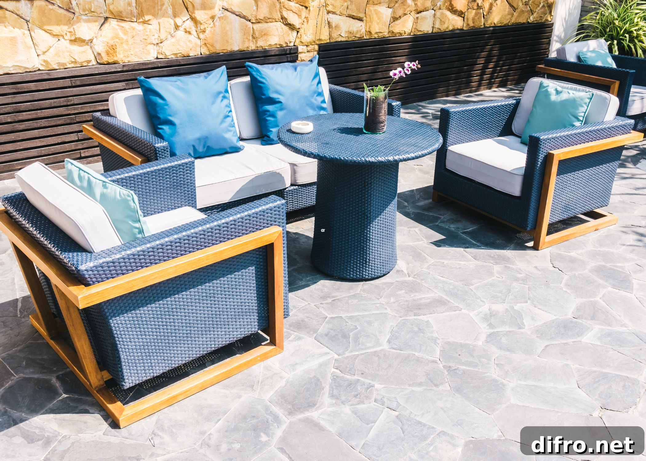 blue wicker patio set on stone patio