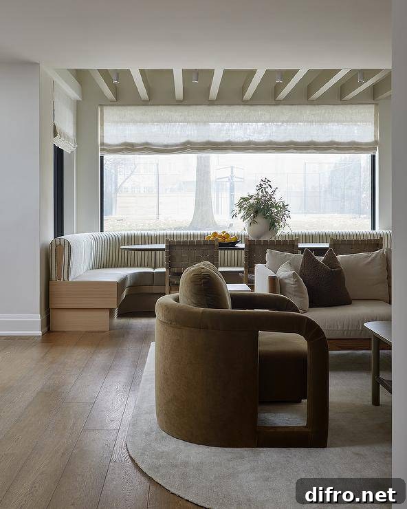 Sage green velvet accent chair on a curved rug