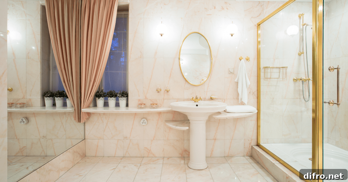 A bathroom with glass shower and metallic fixtures.