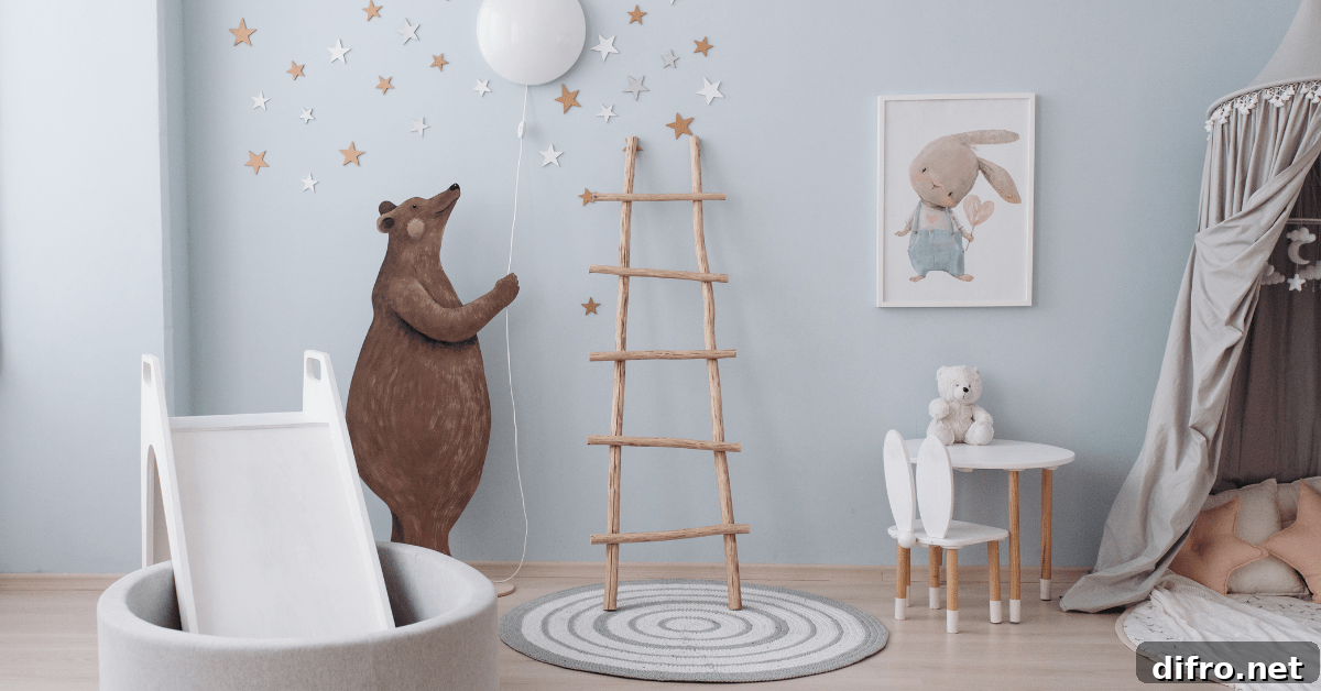 A blue small nursery with bear decoration holding a balloon.