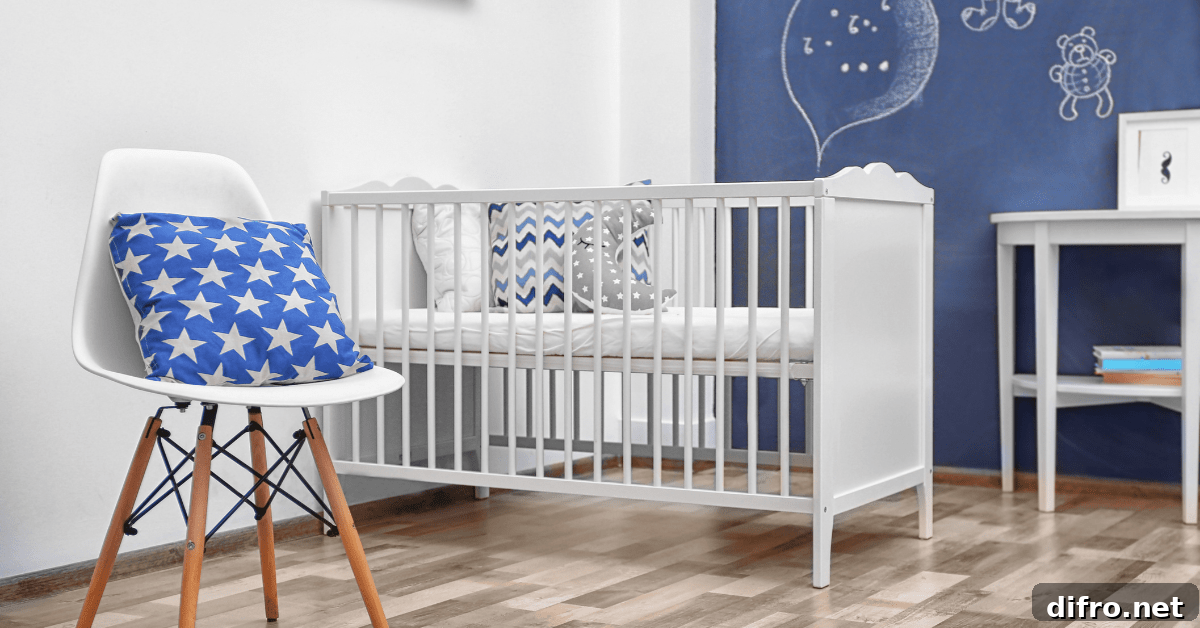 White and blue small nursery with a chair holding a pillow with stars.