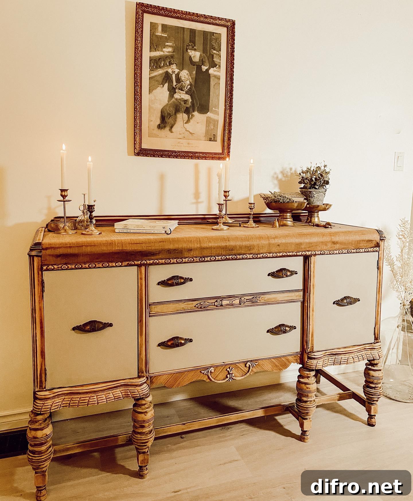 restored hutch with antique brass candlesticks and framed antique picture