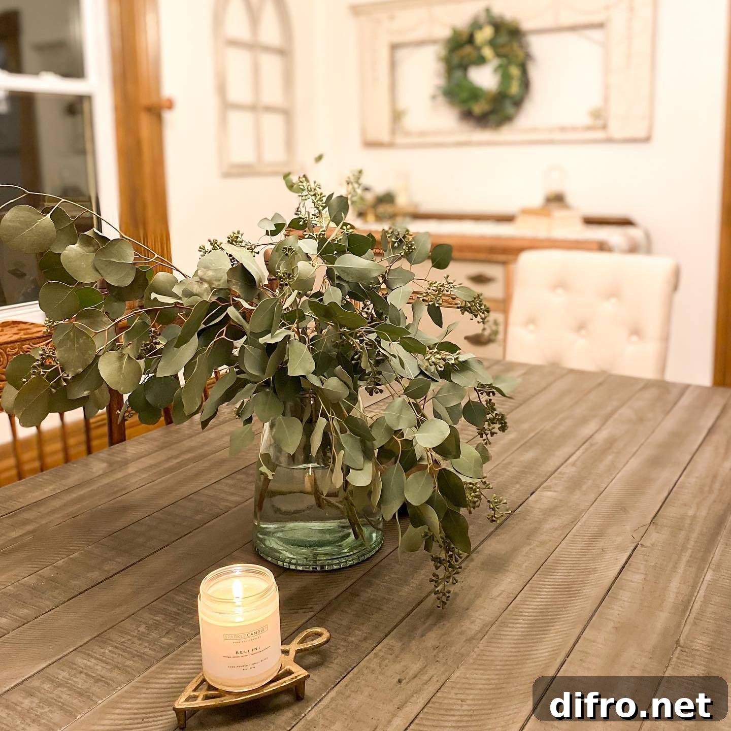 dining table seeded eucalyptus on table lit candle
