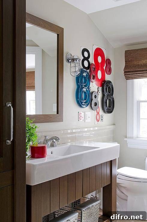 Bathroom with vintage-style vanity, numbered art and classic fixtures.