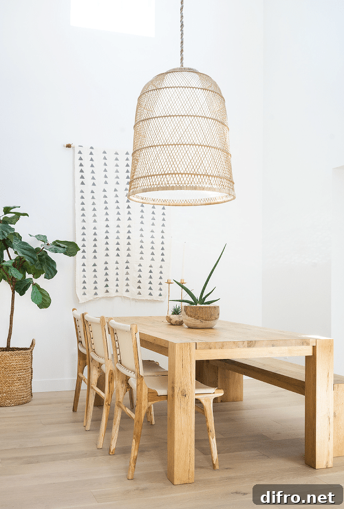 10 Creative Tapestry Hanging Ideas to Transform Any Room 4 Dining table set before a geometric tapestry hung from the wall.