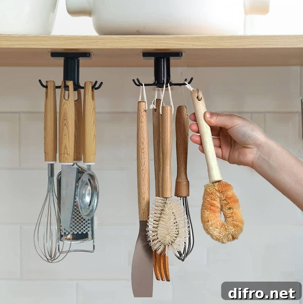 under cabinet hooks with hanging kitchen tools.