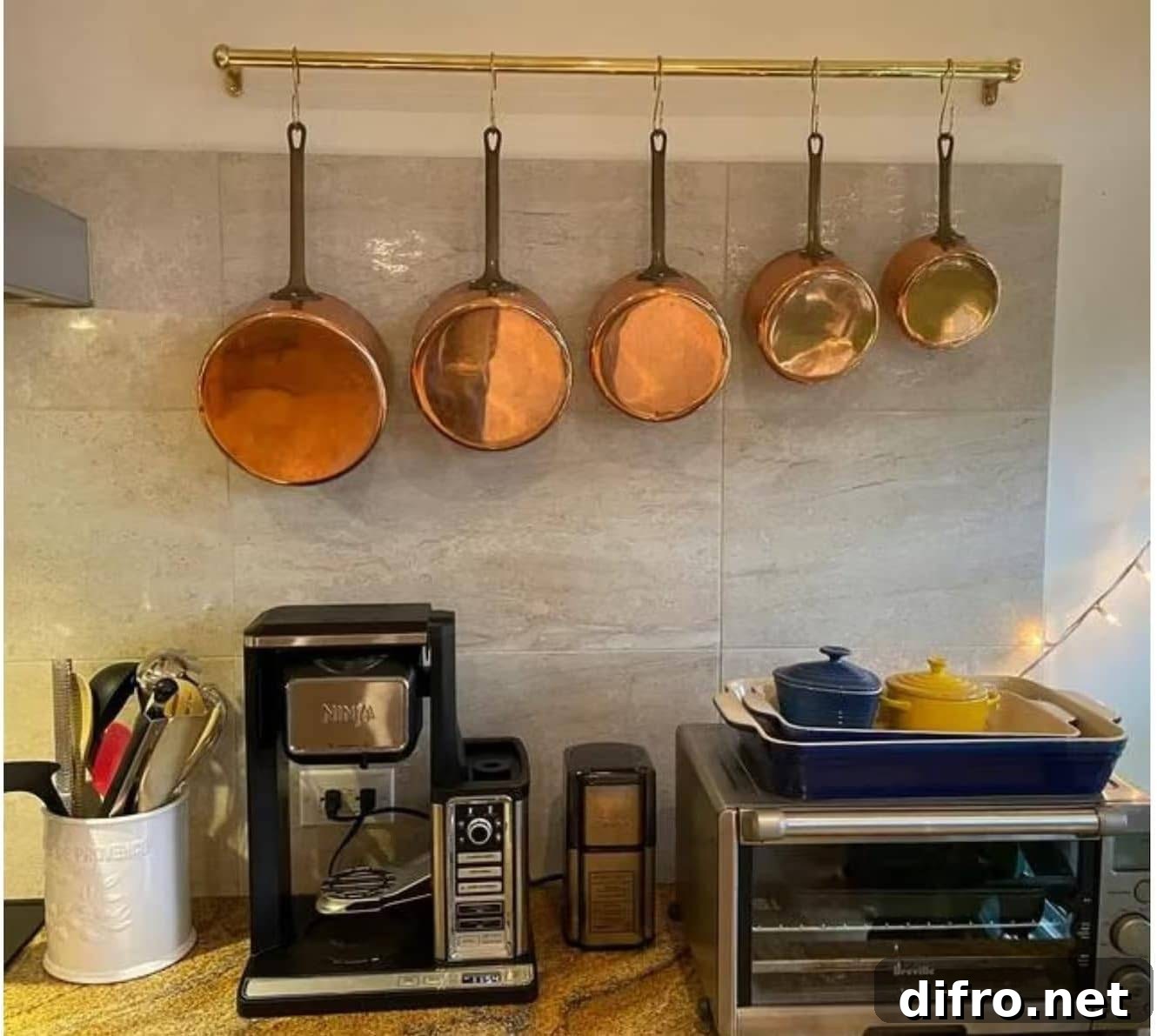 hanging pot rack with copper pots in kitchen.