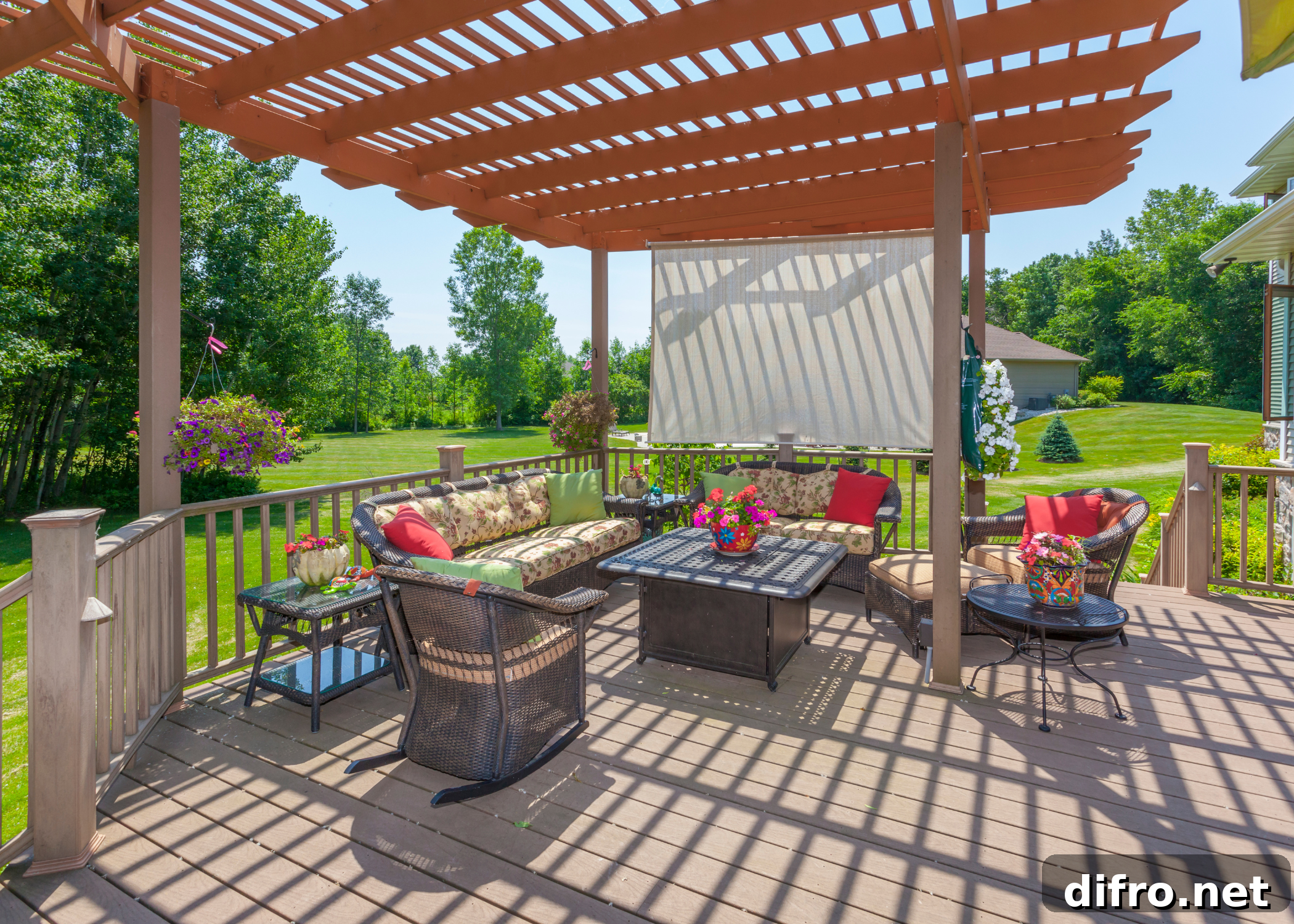 large deck with patio furniture and pergola