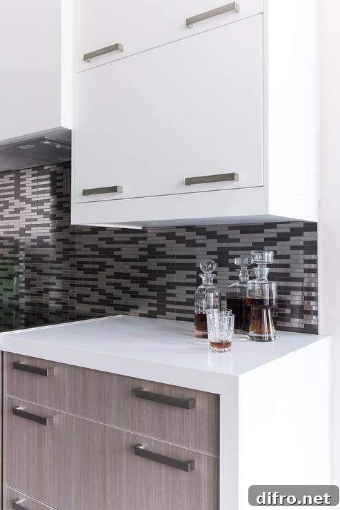 Two-tone kitchen with white flat front upper cabinets and brown oak veneer bottom cabinets.