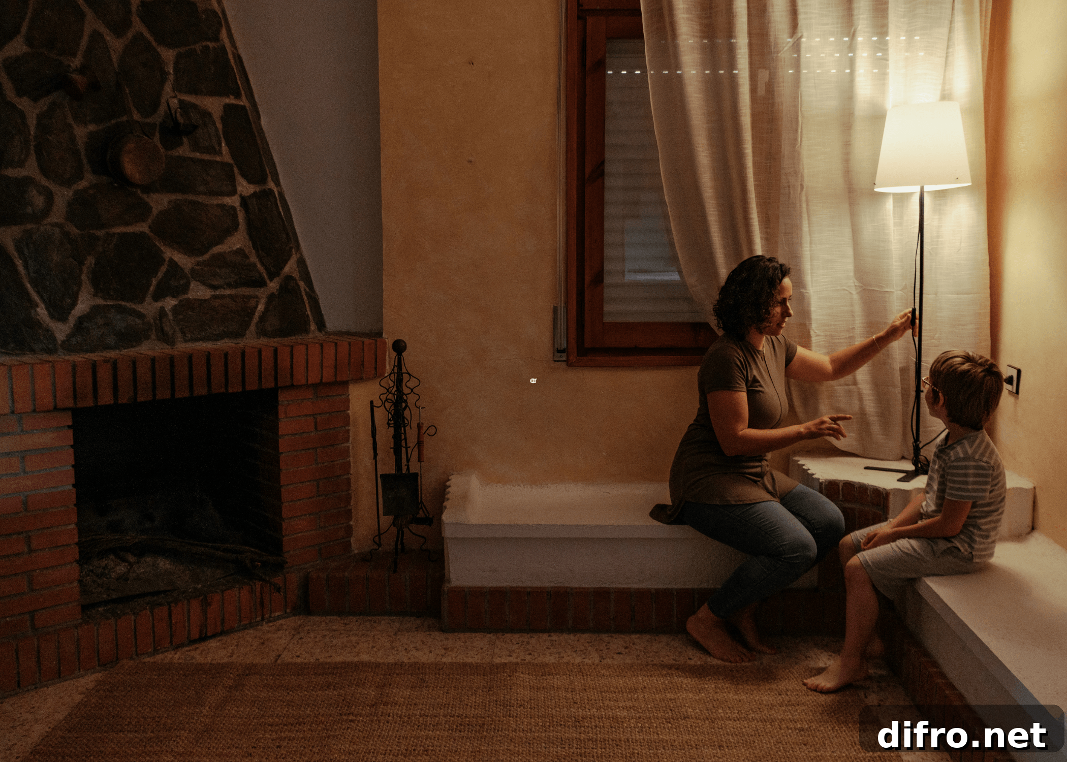 woman and child sitting under lamp dim lighting