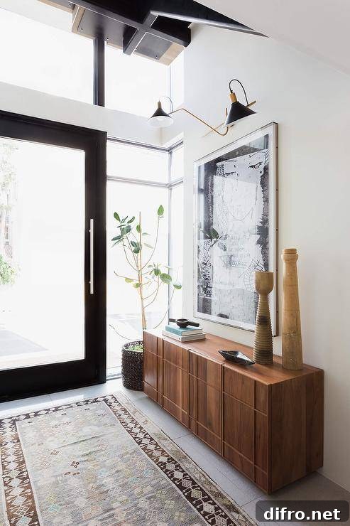 Black front door finished with one large glass panel and flanked by sidelights.