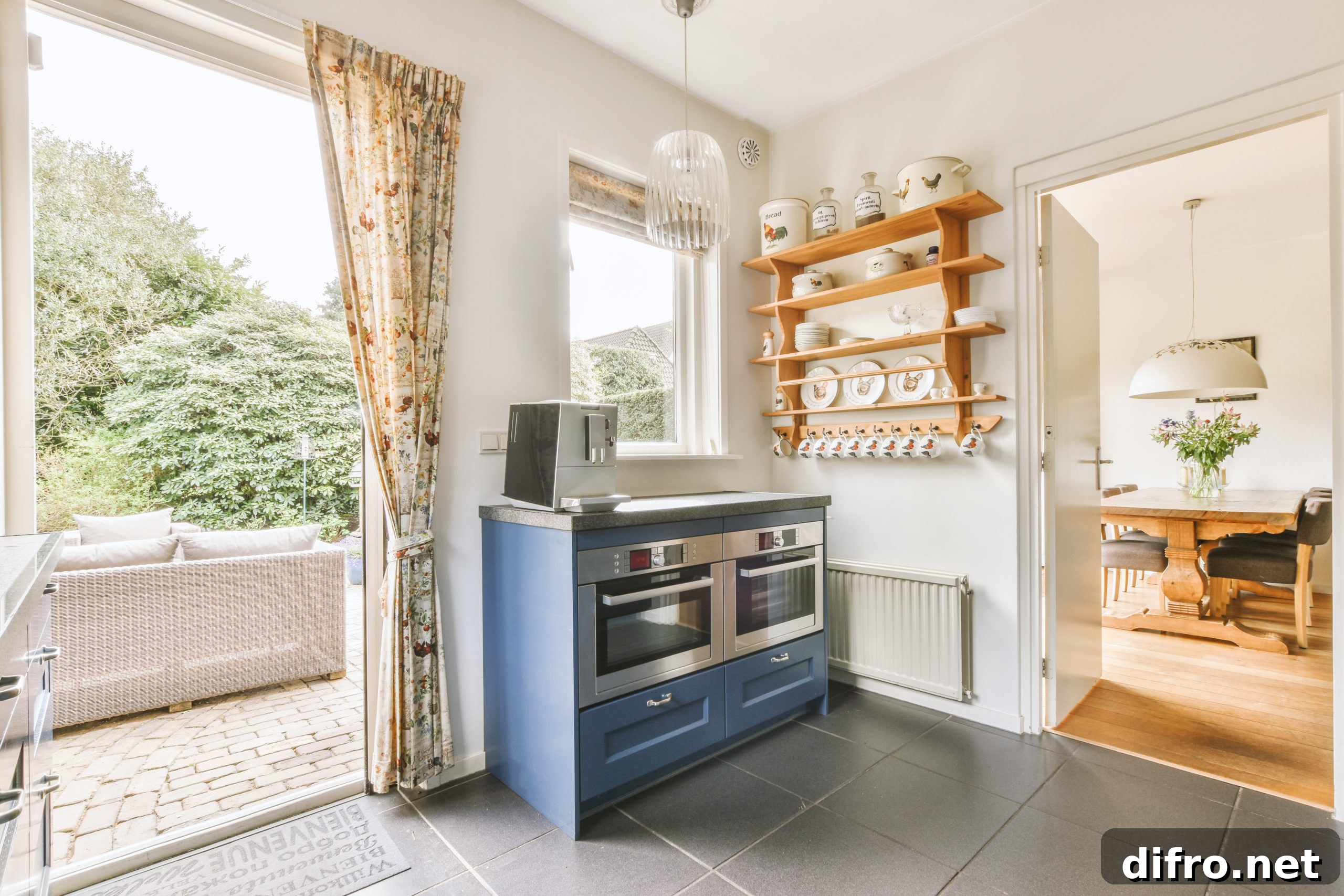 Kitchen fragment with oven under the window and open shelves
