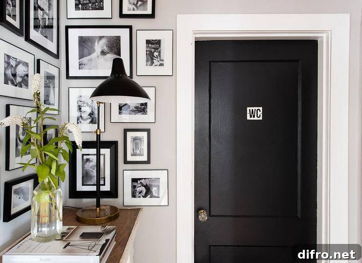 Small entryway with photo wall and white trim