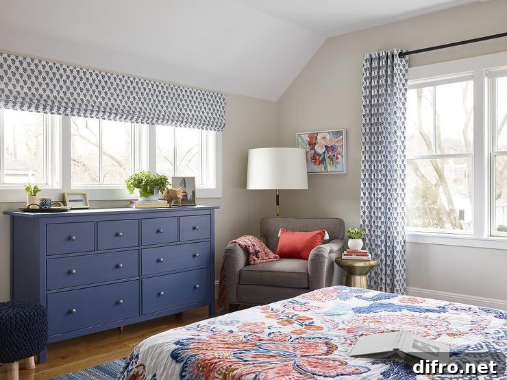 Bedroom with blue dresser and light-filled windows