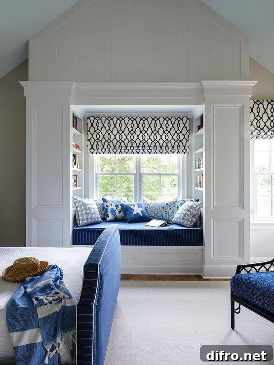 Boy's room features a window seat reading nook with a blue striped cushion and blue pillows.