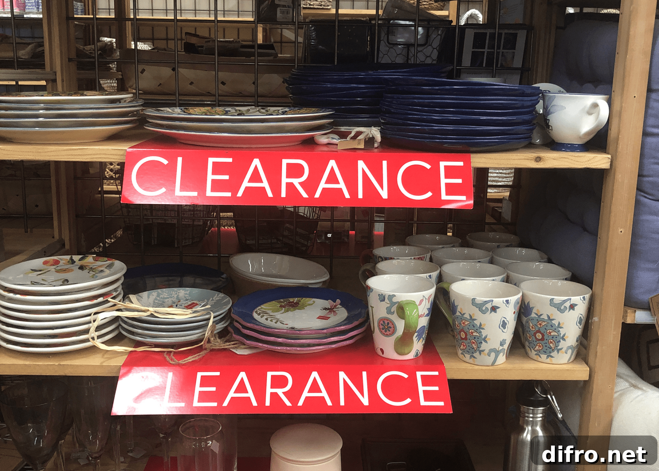 clearance sign on shelves with dishes