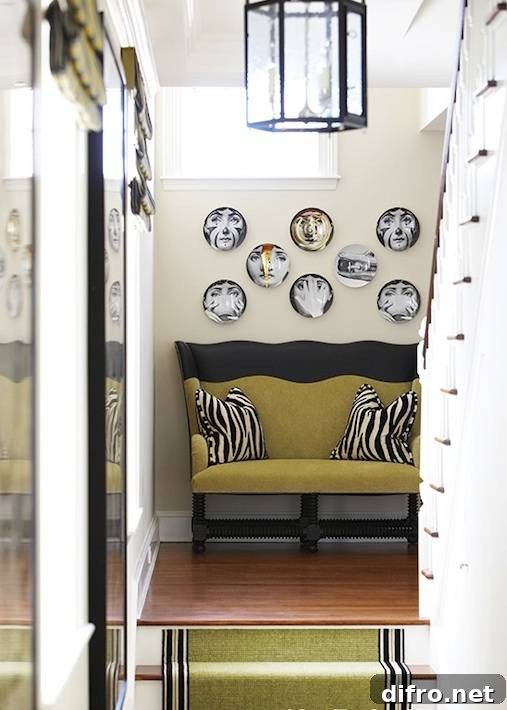 Eclectic foyer with a collection of decorative plates.