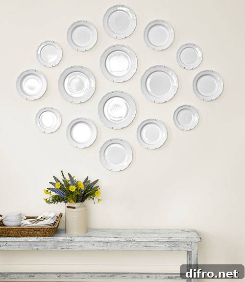 Symmetrically mounted white plates above a distressed bench.
