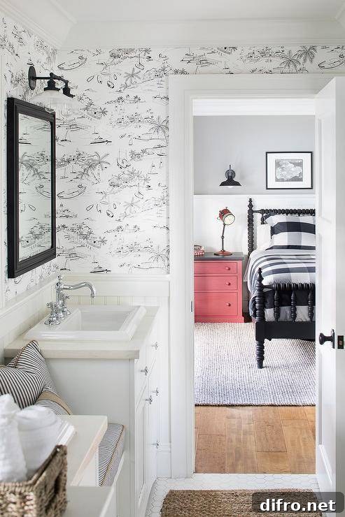 Cottage style bathroom with black and white toile wallpaper.