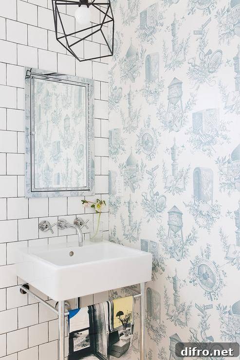 Transitional powder room with white and blue toile wallpaper.