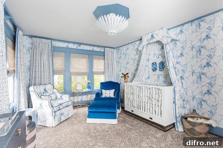Nursery featuring white and blue Toile de Jouy curtains and accents.