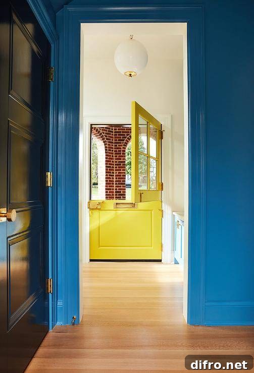 Glossy blue door trim accents a bright blue wall.