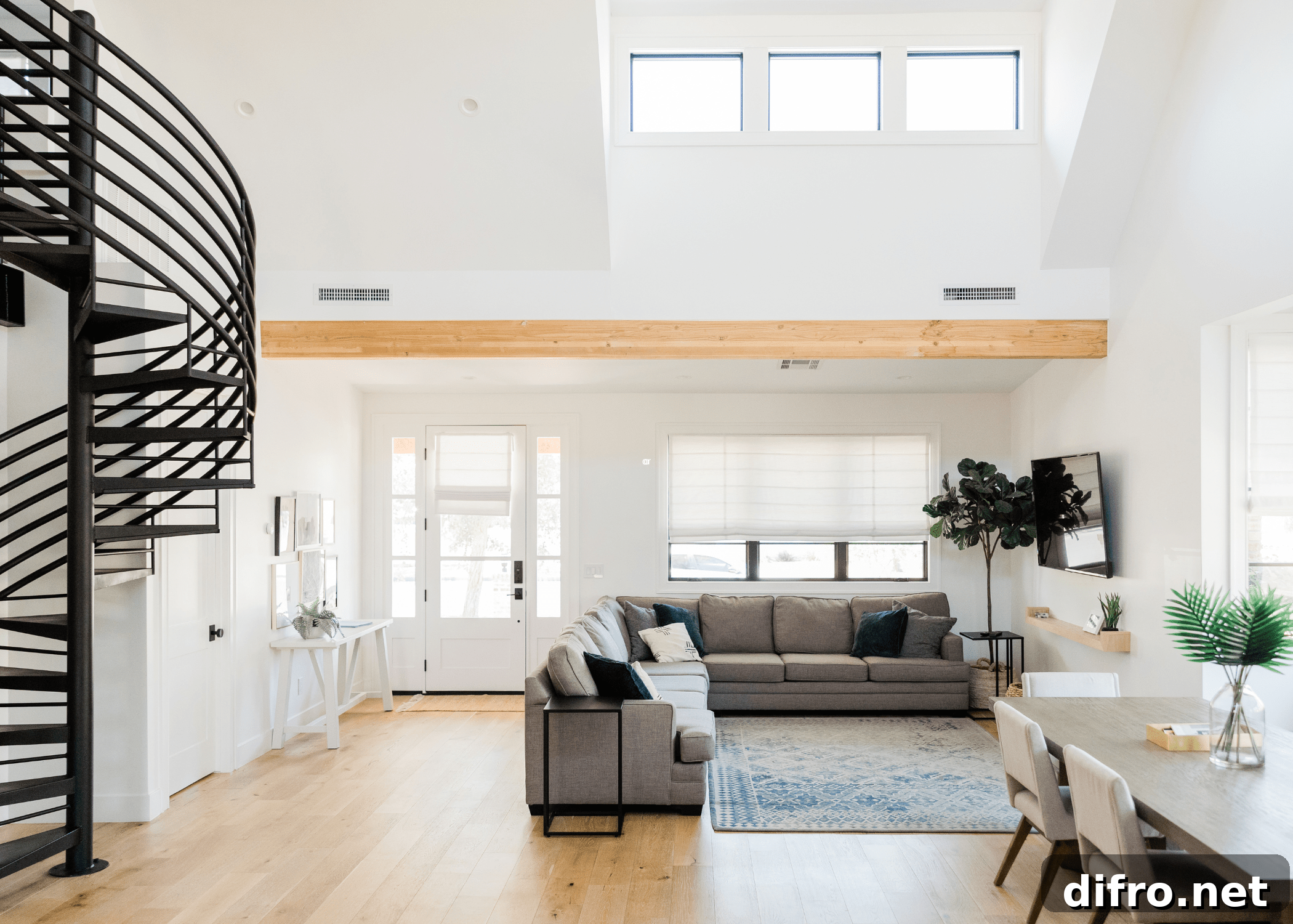 Minimalist living room with spacious layout and minimal furnishings.
