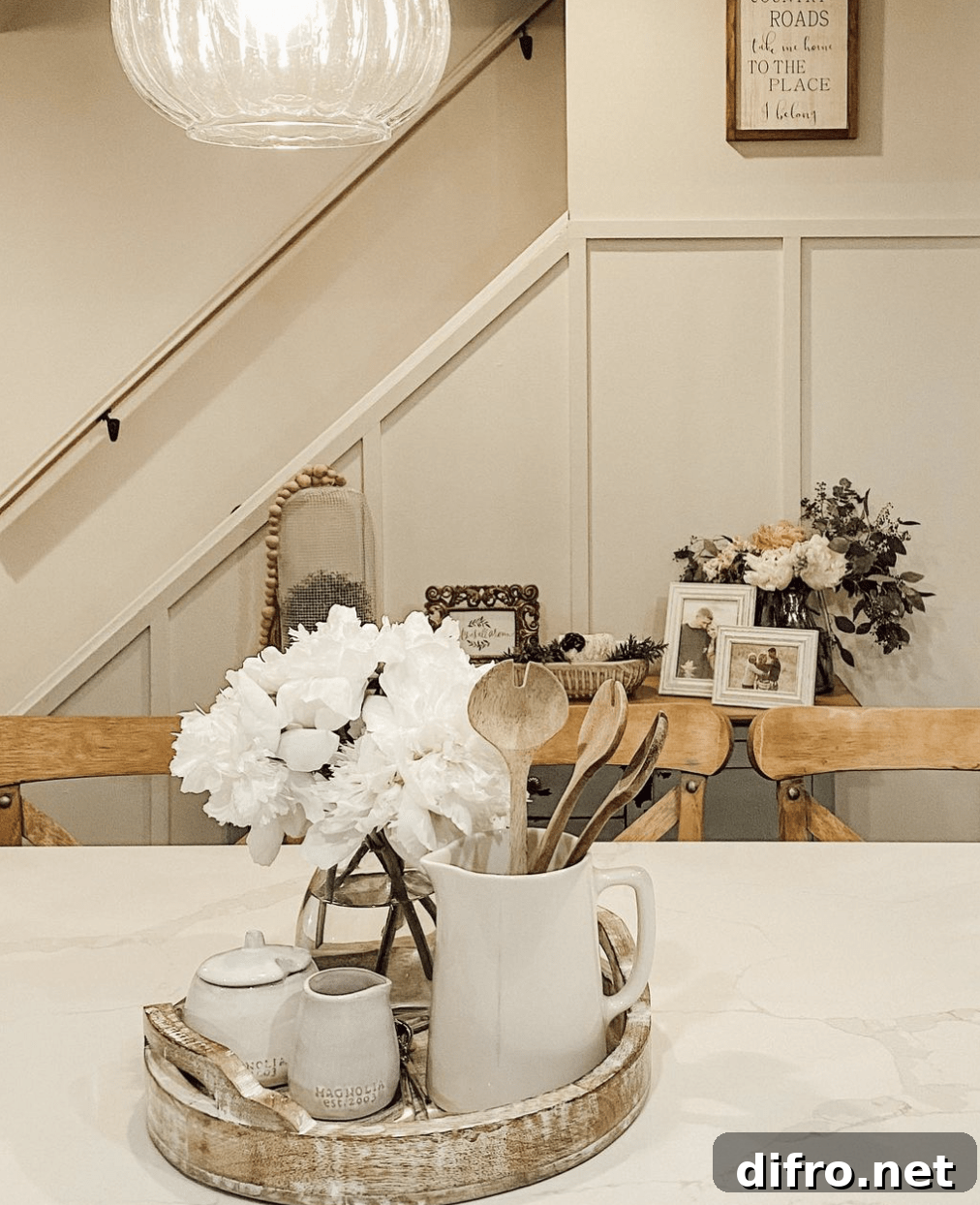 marble countertop decorated with wood tray and flower arrangement