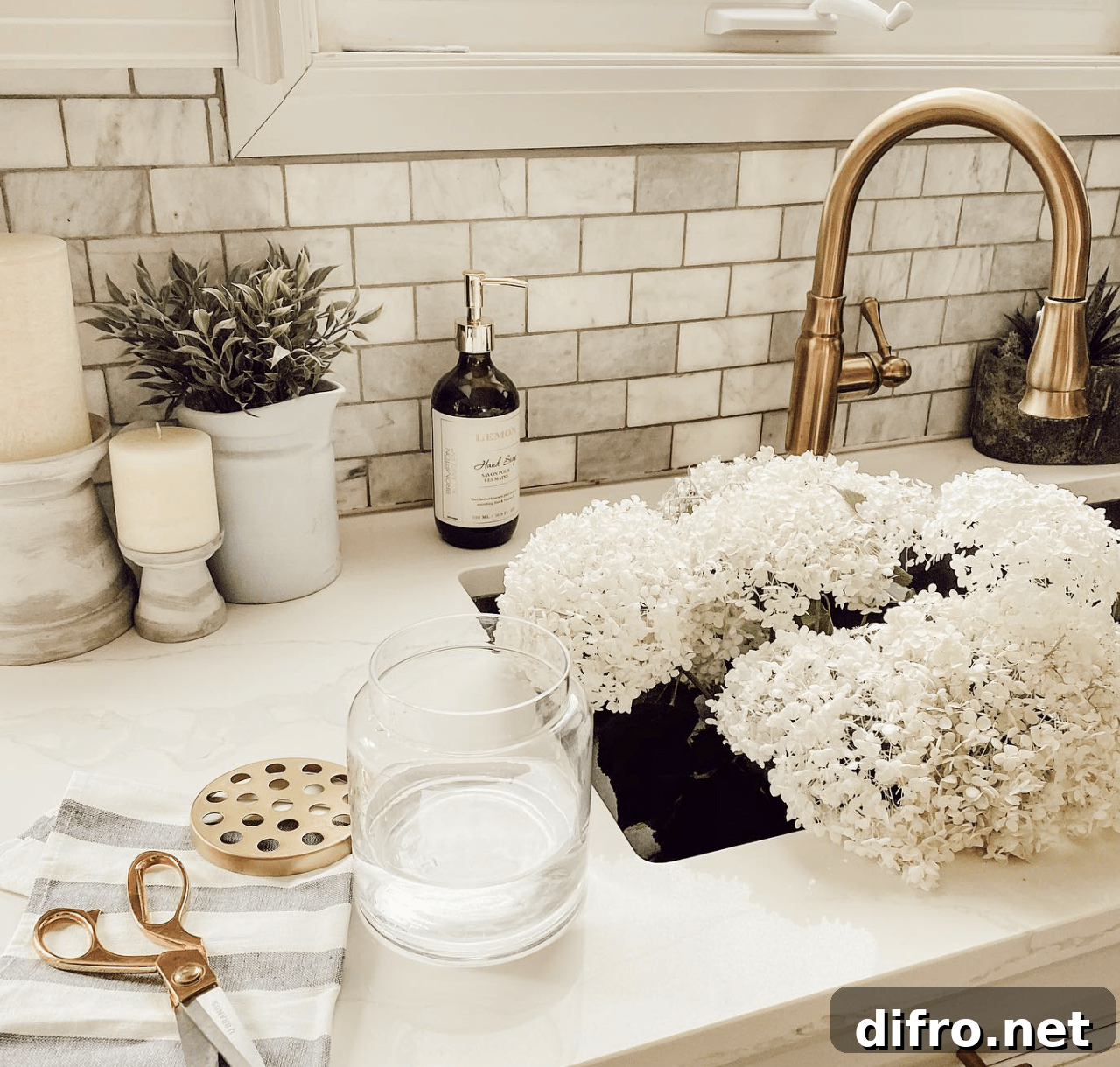 sink full of flowers gold faucet marble countertops