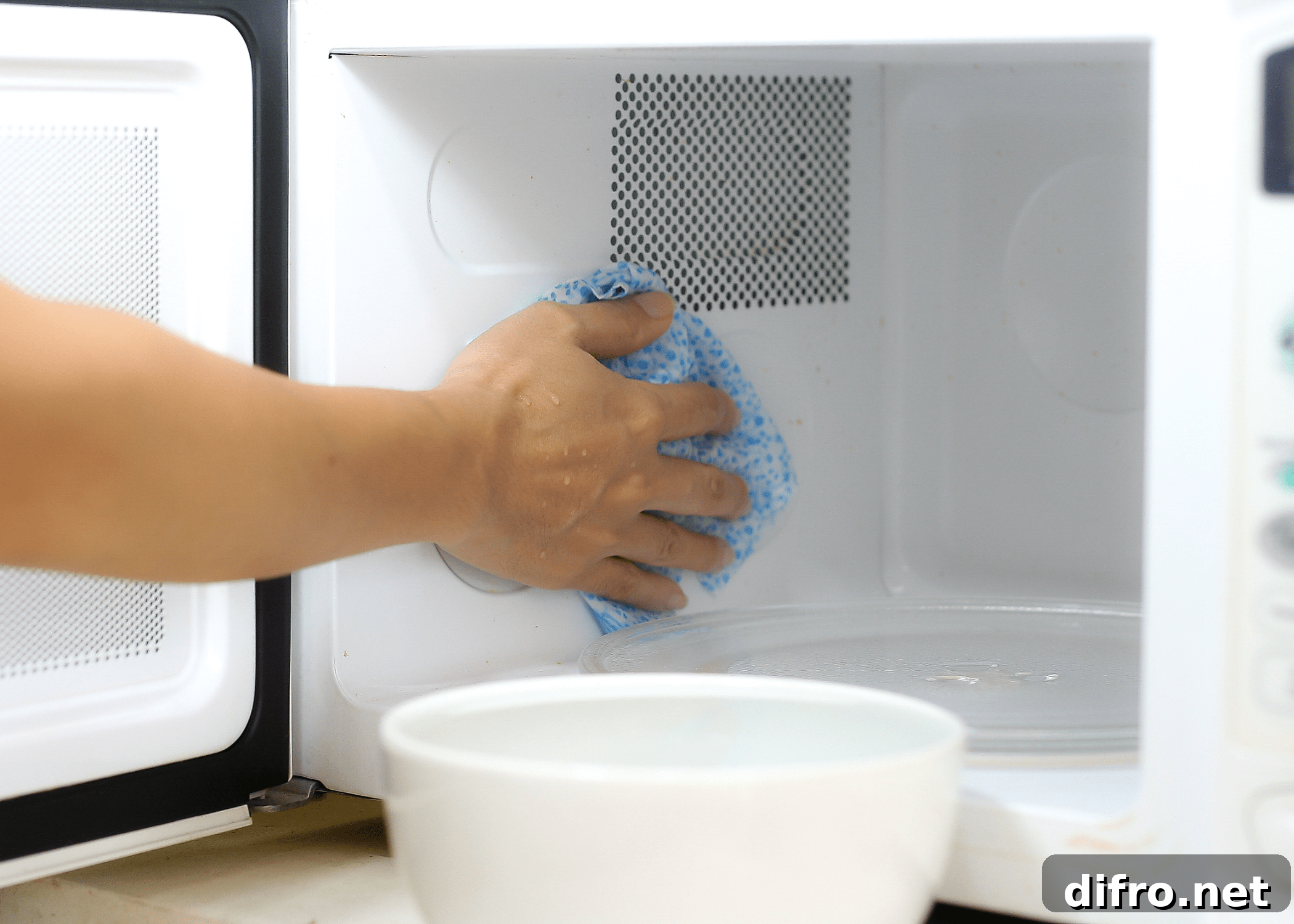 cleaning the inside of a microwave