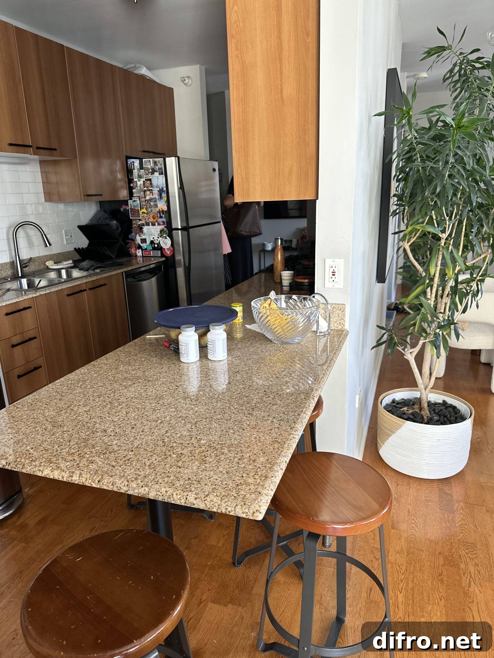 Laminate kitchen island with stools.