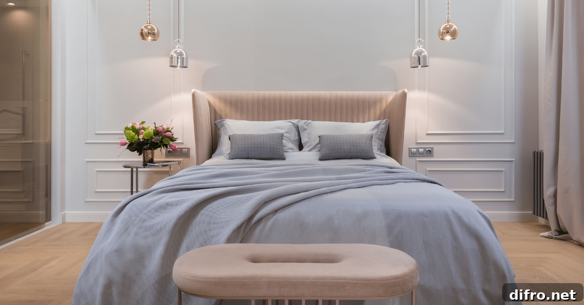Pastel colored bedroom with light fixtures on either side.